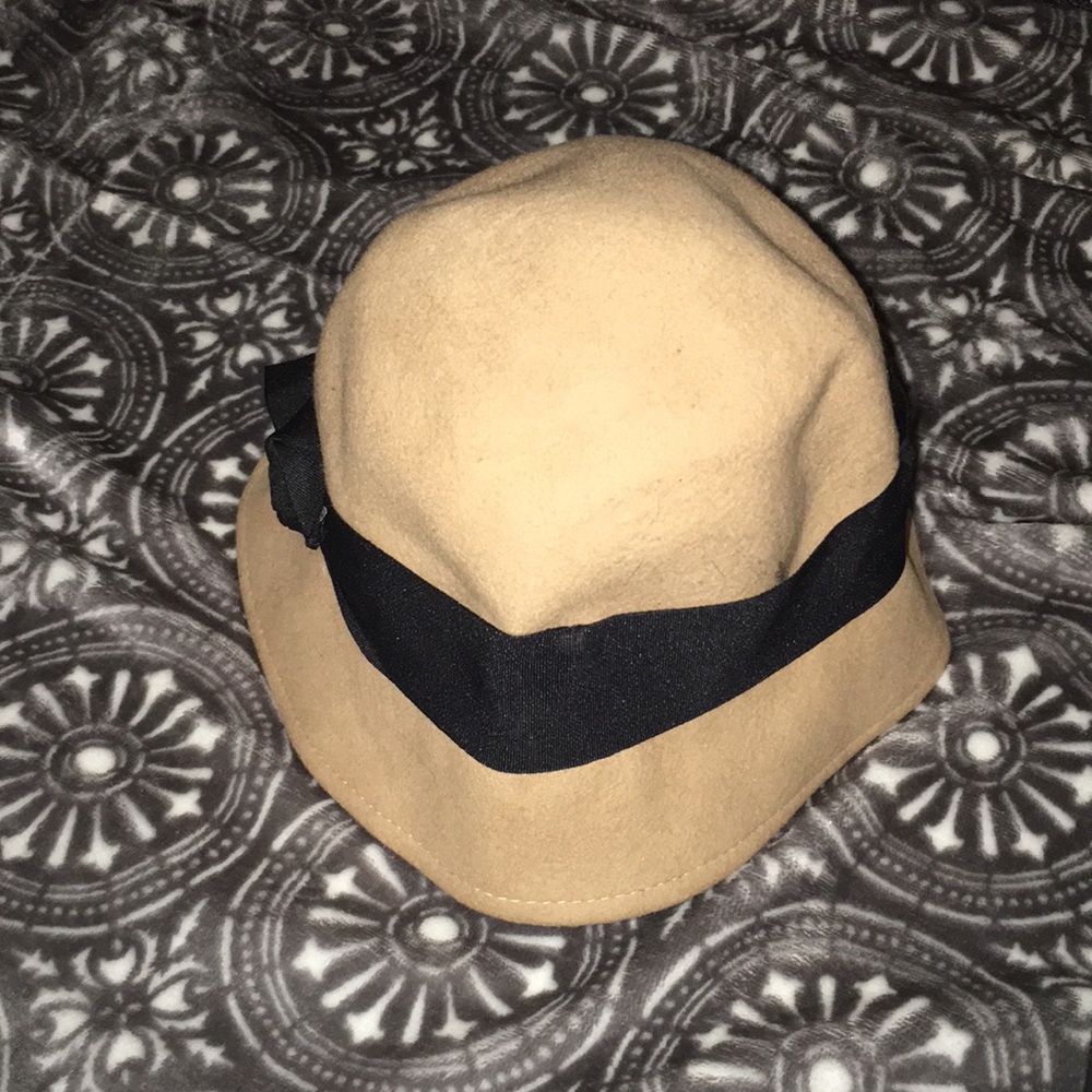 Tan hat with black ribbon